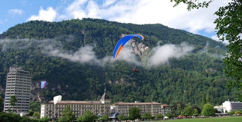 Paragliding in Interlaken offers breathtaking Swiss alpine views.