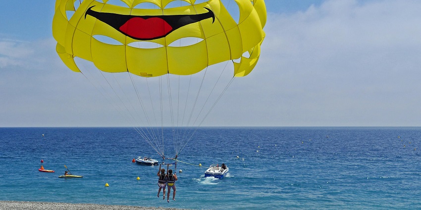 Image of the parasailing activity at New Town Eco Park, with views of the city and park.