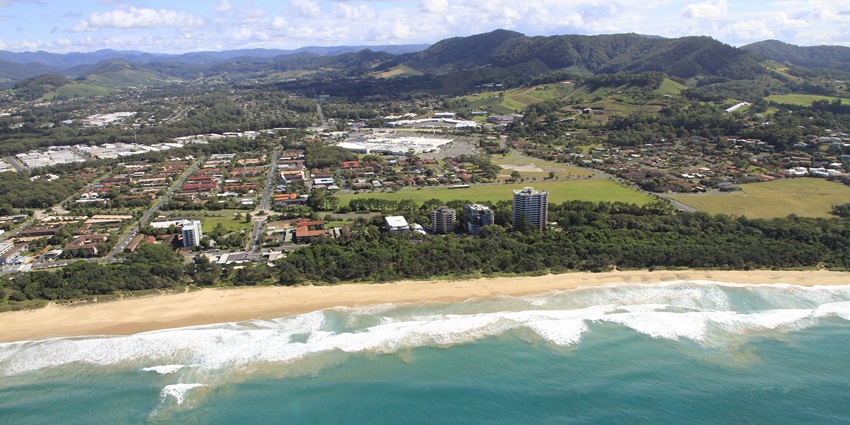 Aerial view of Park Beach, showcasing its sandy shoreline and adjacent green parkland.