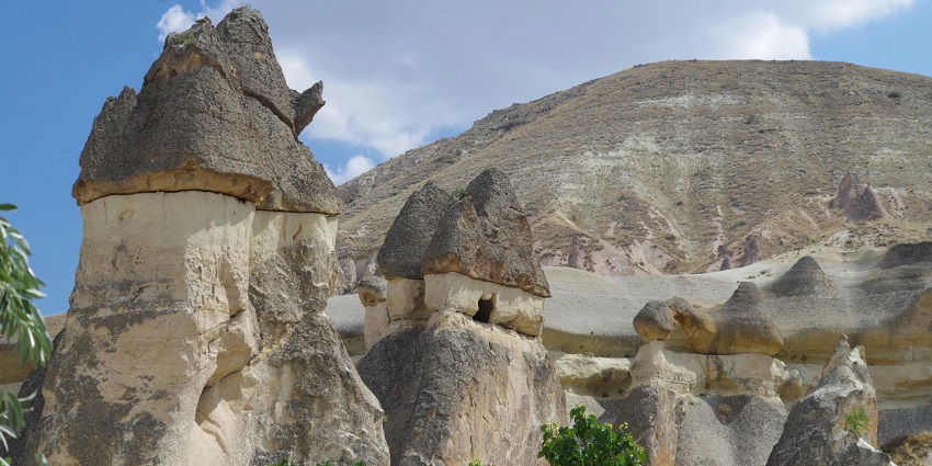 A unique rock formation resembling chimneys, creating a surreal landscape views.