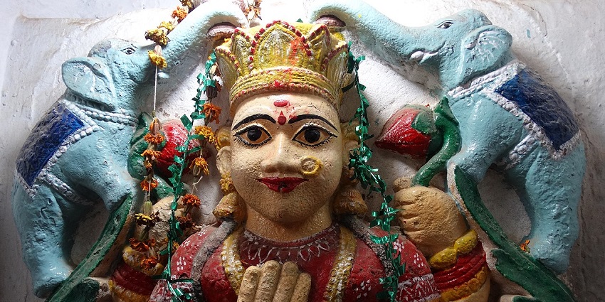A frontal view of an idol at an ancient temple, which is one of the best places to visit in Allahabad