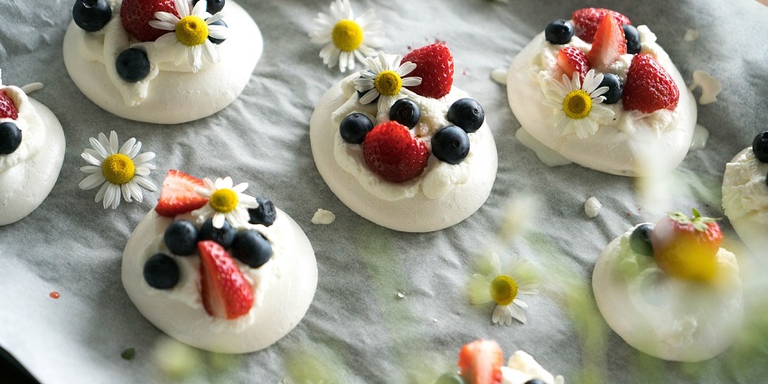 Pavlova topped with fresh fruits, the sweetest slice of the best foods in Australia.