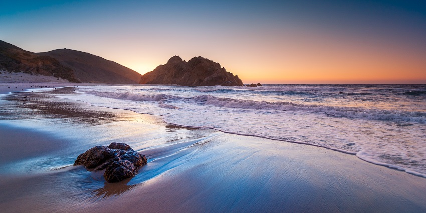 An image showing the unique purple sands of Pfeiffer Beach in Big Sur, California