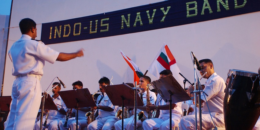 A picture of the U.S. Navy Band performing outdoors at Aircraft Museum Kolkata.