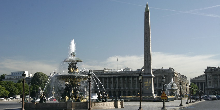 Iconic Paris square with grand fountains, obelisk, and statues.