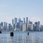 Canada city skyline view across a water body and many skyscrapers including the CN Tower