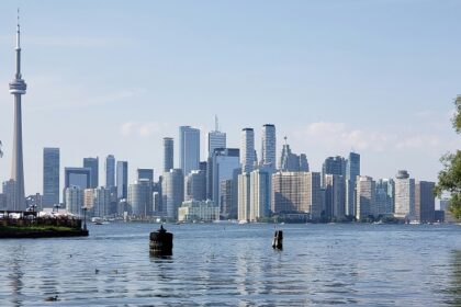 Canada city skyline view across a water body and many skyscrapers including the CN Tower