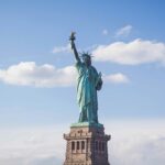 Statue of Liberty in New York under cloudy white - places to visit in july in the USA