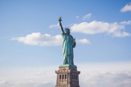 Statue of Liberty in New York under cloudy white - places to visit in july in the USA