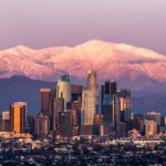 Sunset in Los Angeles skyline with Mount Baldy in the background after a large snowstorm