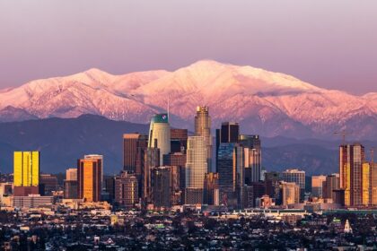 Sunset in Los Angeles skyline with Mount Baldy in the background after a large snowstorm