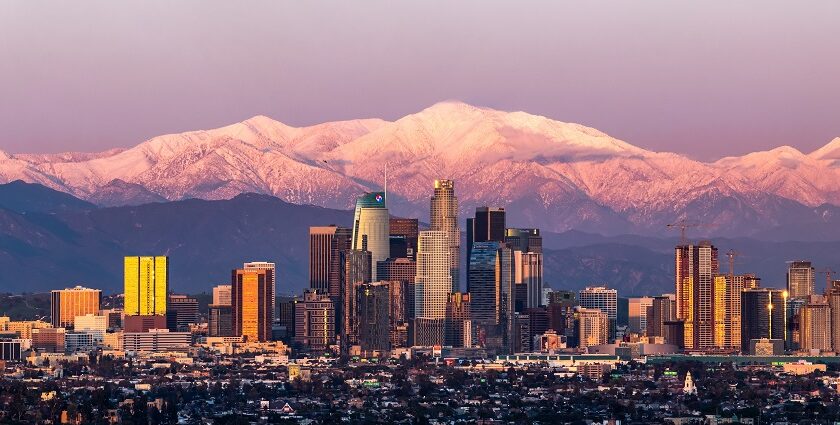 Sunset in Los Angeles skyline with Mount Baldy in the background after a large snowstorm