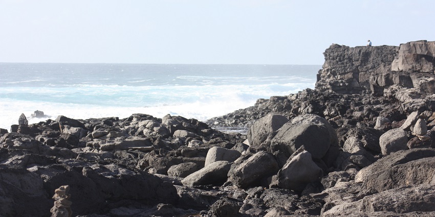 A view of Playa Blanca, located at Punta Pechiguera, leading to a turquoise sea.