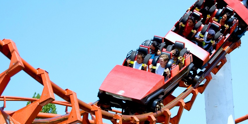 A rollercoaster known as corkscrew is showcased in Playland, with several people in it
