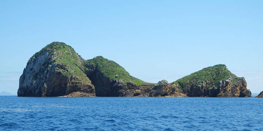 A natural tunnel in the Poor Knight Islands near New Zealand