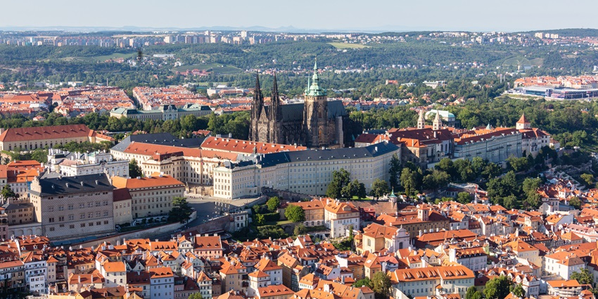 A view of Prague Castle, showcasing its medieval architecture and surrounding landscape.