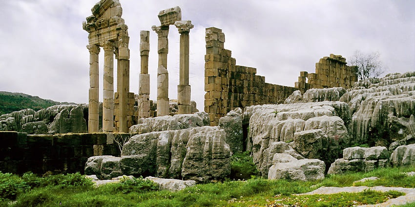 Archaeological site featuring temples and stunning mountain views