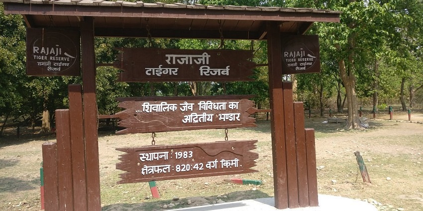 A glimpse of a signboard located at Rajaji national park, a place near the temple in Uttarakhand.