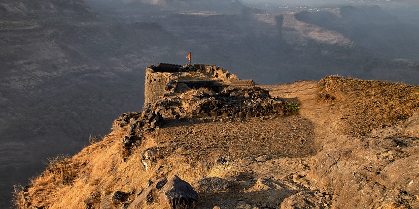 An image showcasing the historical significance and views from Rajmachi Fort during trekking