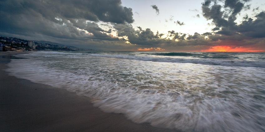 An imag eof bech sunset - the best beach in Lebanon with soft white sands