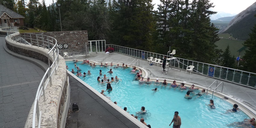People enjoy dipping in an artificial hot spring in Banff Upper Hot Springs, Alberta.
