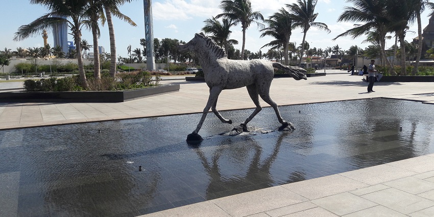 Image of scenic waterfront promenade with views, parks, and activities