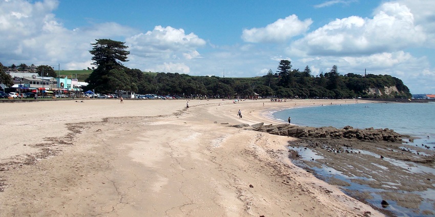 A lively beach scene, the most relaxing experience among things to do in Auckland.