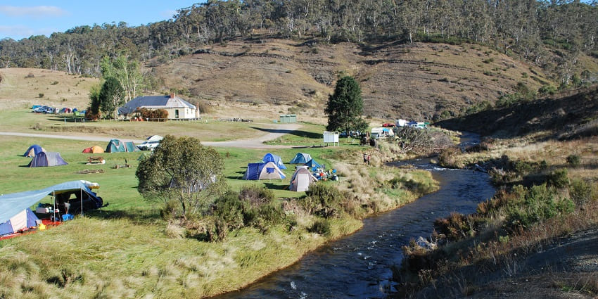 Tranquil riverside camping experience amidst nature’s serenity