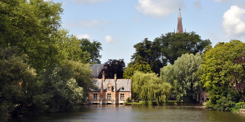 A glimpse of romantic park featuring a serene lake and scenic walking paths.