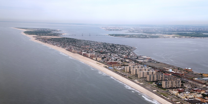 Aerial view of Rockaway Beach, a New York beach showcasing the long stretch of coastline.