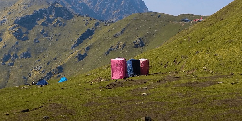 Trek to the mysterious Roopkund Lake surrounded by mountains.
