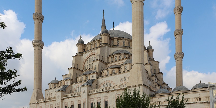 Majestic mosque with expansive courtyards and stunning central dome.