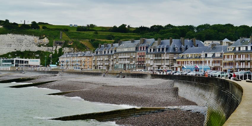 Coastal town featuring pebble beaches, cliffs, and historic sites