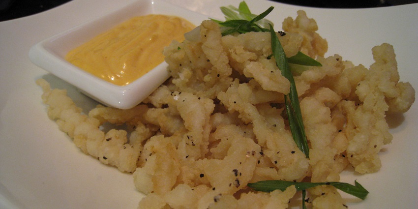 Crispy salt and pepper calamari, perfect for seafood lovers.