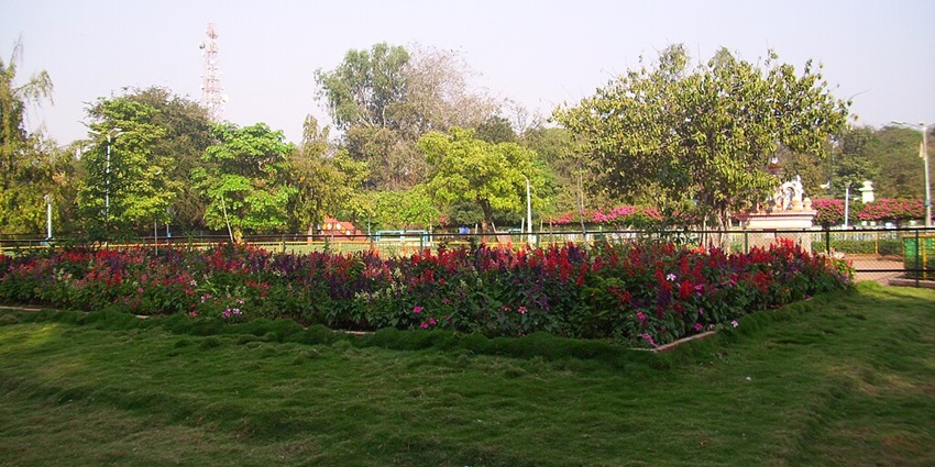 Picturesque view of the Sarasbaug Garden In Pune with lush greenery and colourful flowers