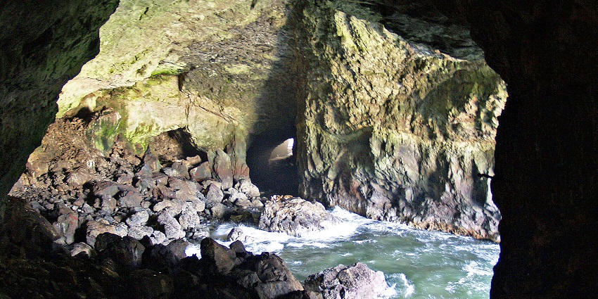 Hidden caves near Sattal Lake amidst dense, peaceful forests.