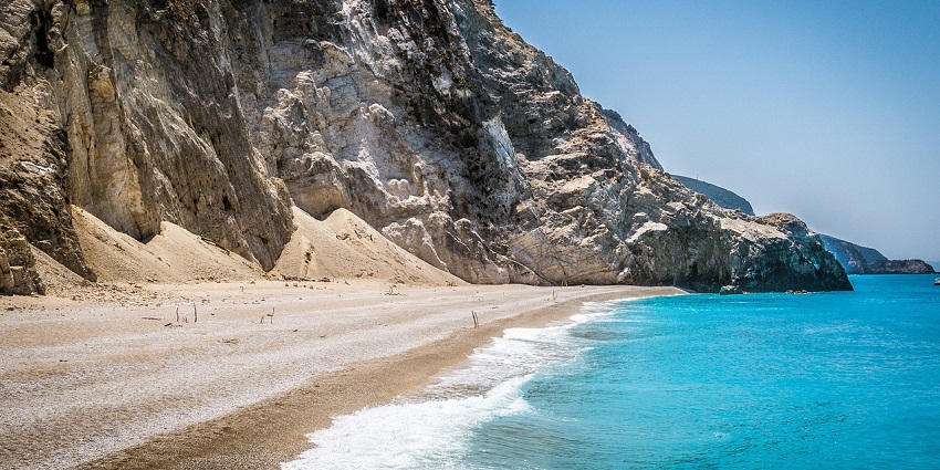 An image of a calm Sea Island which offers pristine sandy shores and water sports.