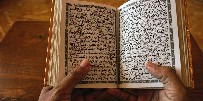 An image of a woman praying in the Selden Masjid in Long Island, New York.