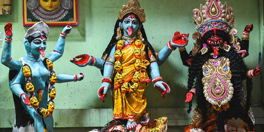 An image of statues of goddesses in Shovabazar Rajbari Durga temple on display.
