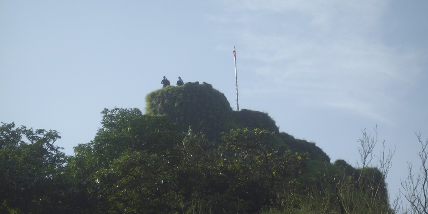 A view of Shrivardhan Fort's ruins and panoramic vistas from its summit during trekking