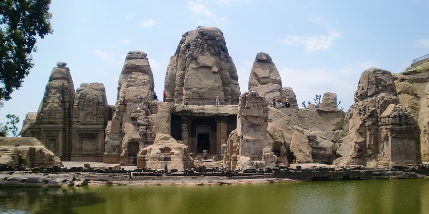 A view of a stone Hindu temple on a large rock, a famous temple in the USA.