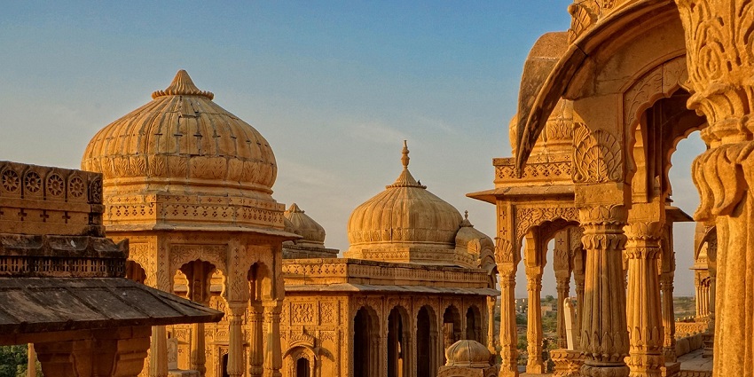 A dome is lit by the warm glow of the golden hour sunset - one of the temples in Toronto.