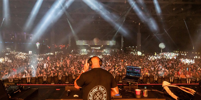 DJ playing music with a laptop and equipment - one of the music festivals in Greece.