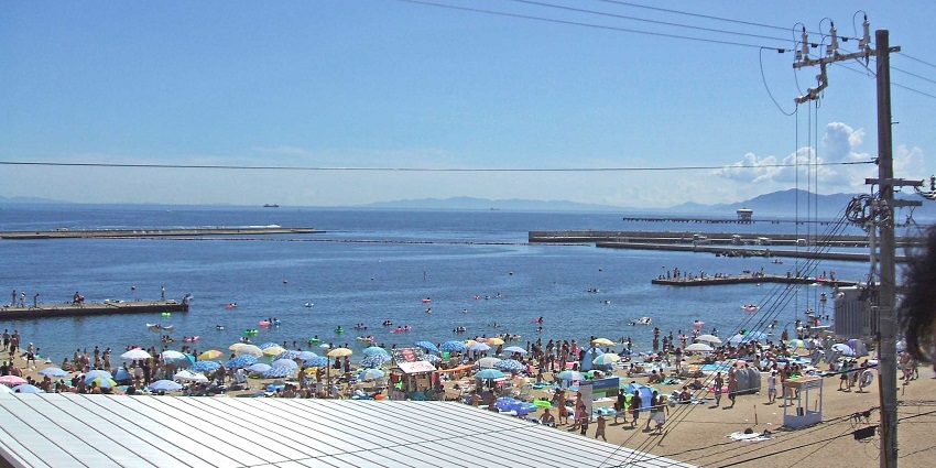 Lively beach with crystal-clear waters and beach clubs for entertainment