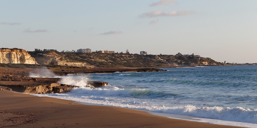 Relax and sunbathe on the golden sands of Lara Beach.