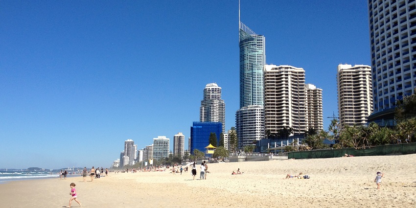 Skyscrapers towering around Surfers Paradise Beach - one of the beaches in Queensland.