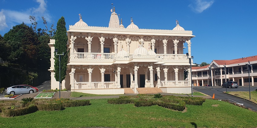 The entrance of Swaminarayan Temple in New Zealand located amidst nature