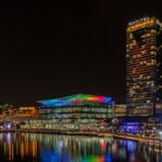 The illuminated skyline highlights the vibrant Sydney nightlife scene.