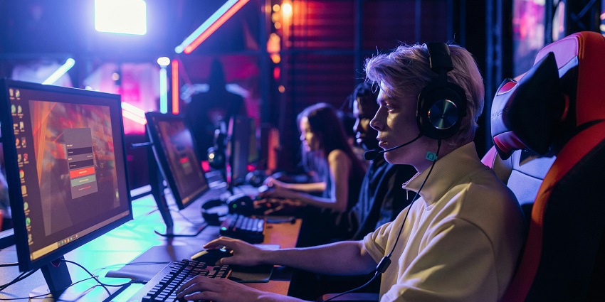 An image of a man playing a game in the TAP Esports Centre, a famous place near Einstein brain