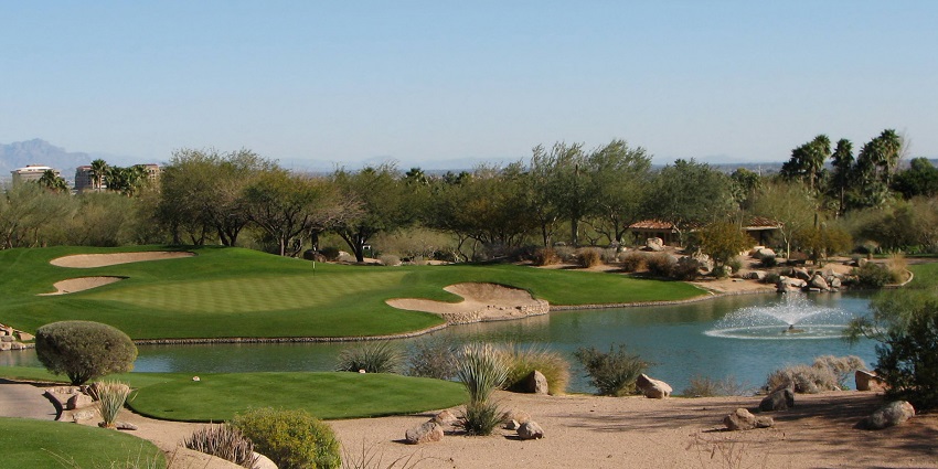 A man playing golf on a sunny day at a popular tourist destination near the Musical Instrument Museum.